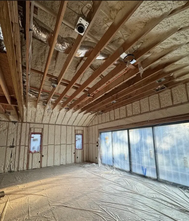Interior walls and ceiling insulated with spray foam during new construction in East Palo Alto